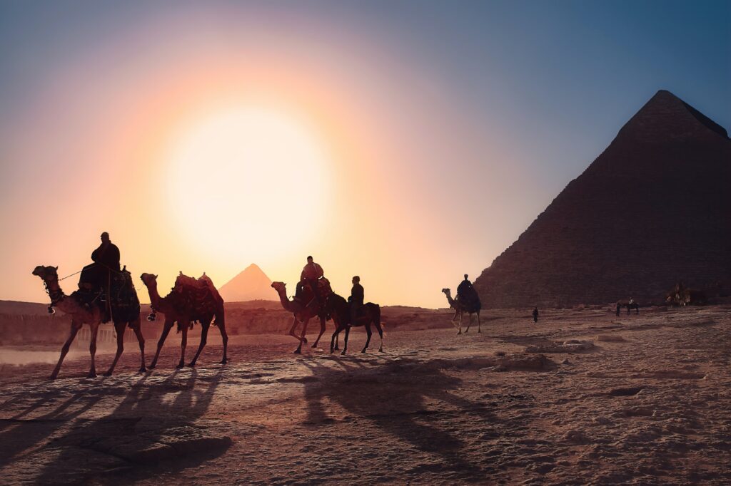 Camel Riding at the desert at sunset