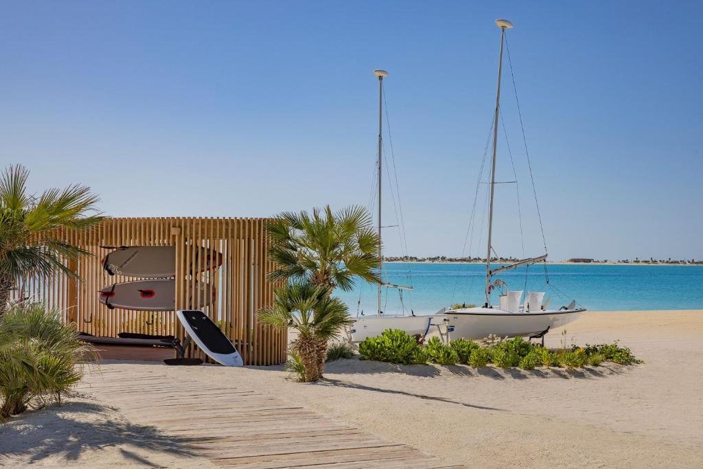 White sand beach and turquoise sea at St. Regis Red Sea Resort
