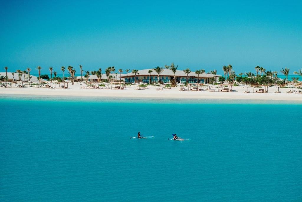 Turquoise shoreline and white sand at St. Regis Red Sea Resort on Ummahat Island 1