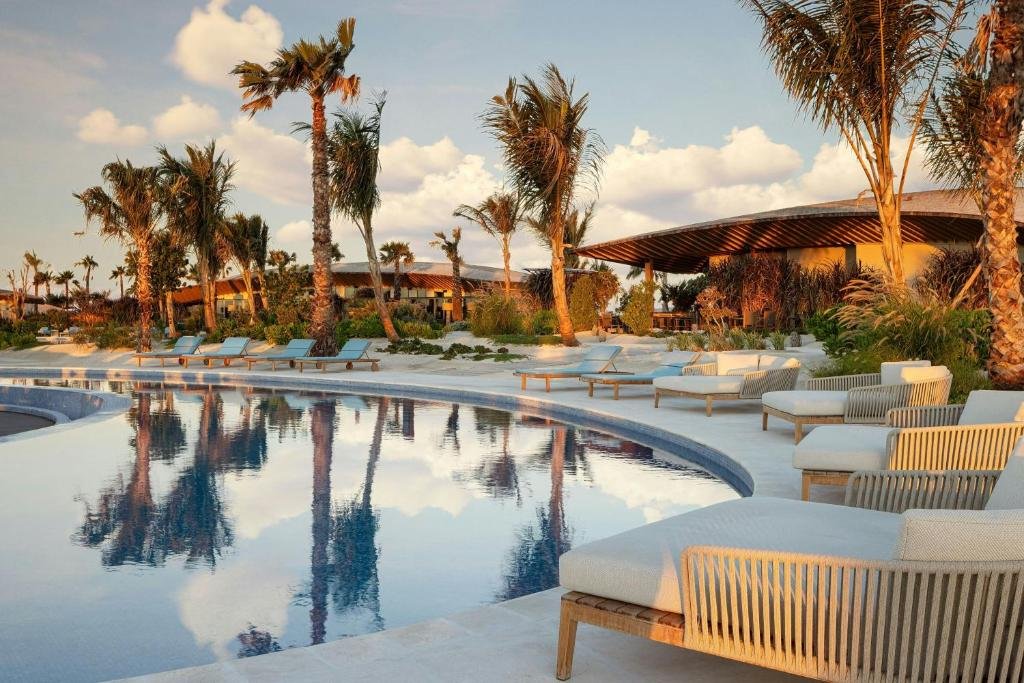 Main resort pool with sun loungers at St. Regis Red Sea Resort