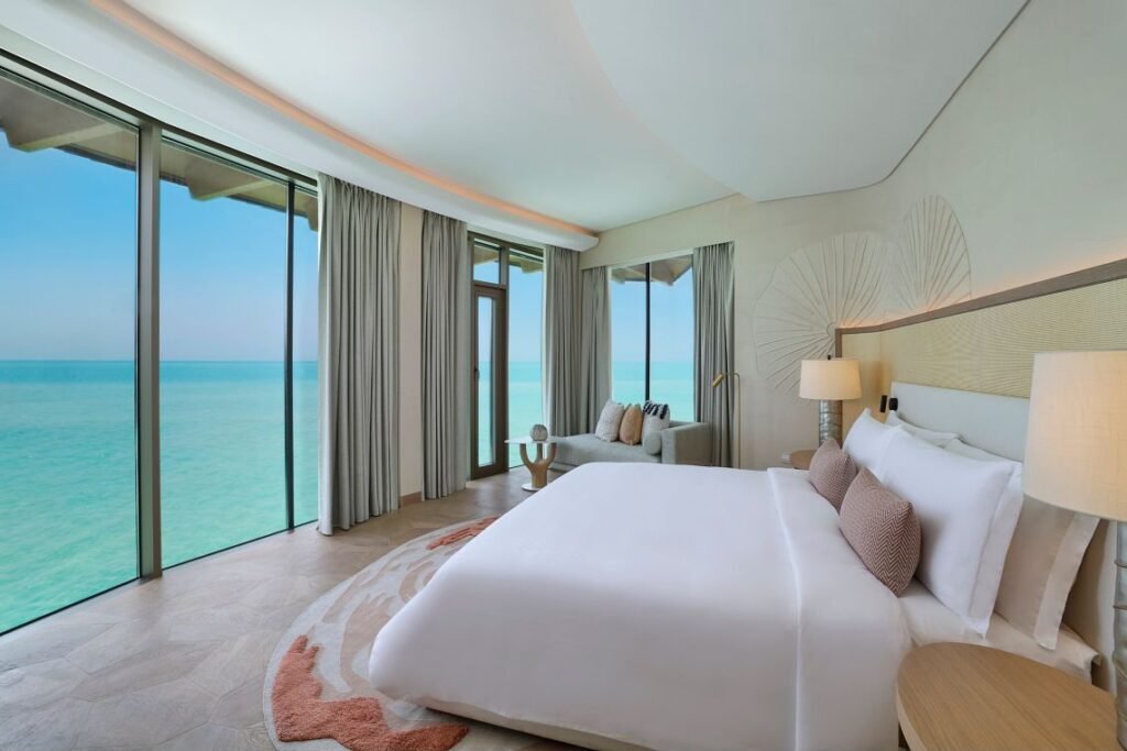 Bedroom in an overwater Sunset Coral Villa at St. Regis Red Sea Resort
