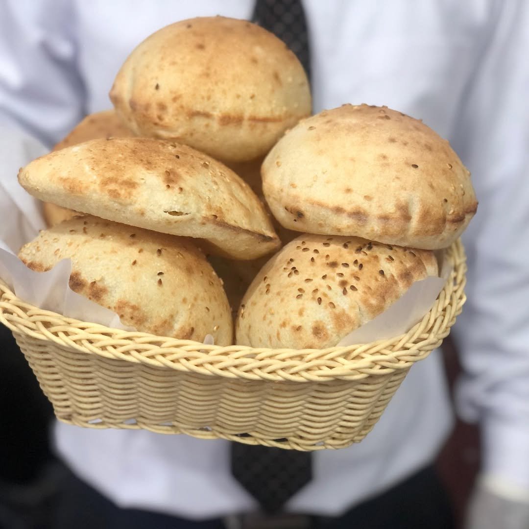 Sesame khubz bought oin neighborhood bakery in Old Muharraq