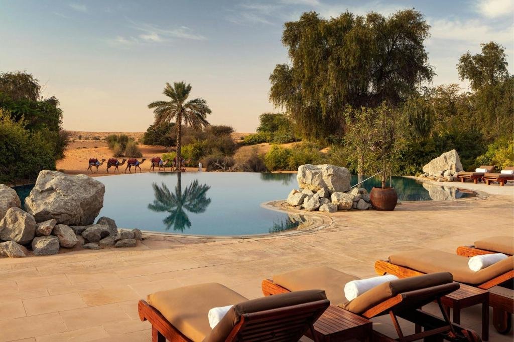 Desert oasis with pool and loungers