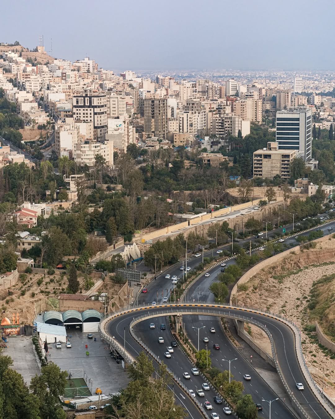 Cityscape with winding road and buildings