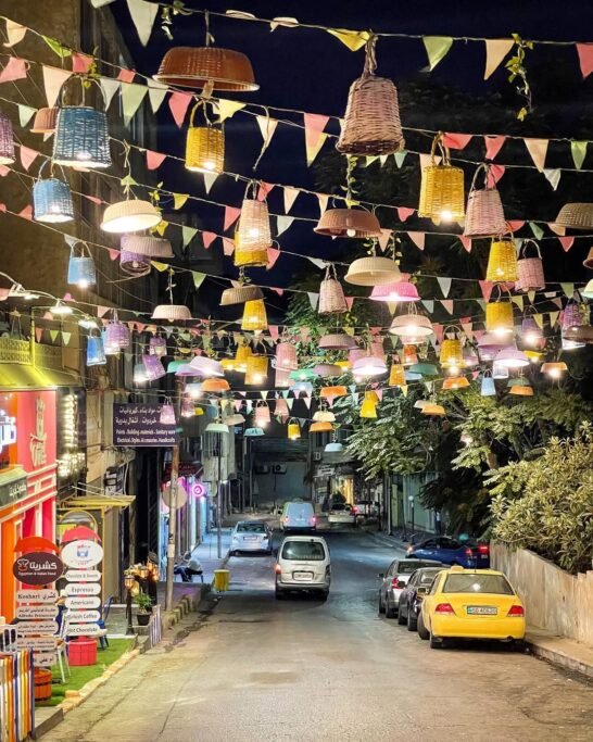 Colorful street decorated with hanging baskets in Amman