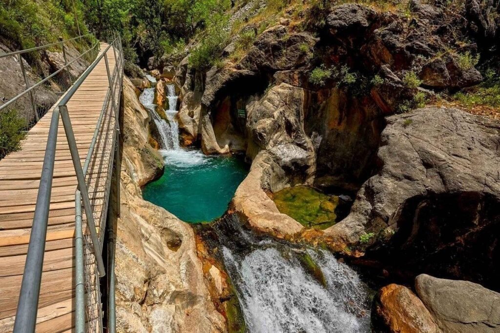 Wooden walkway and waterfall scenery at Sapadere Canyon near Alanya
