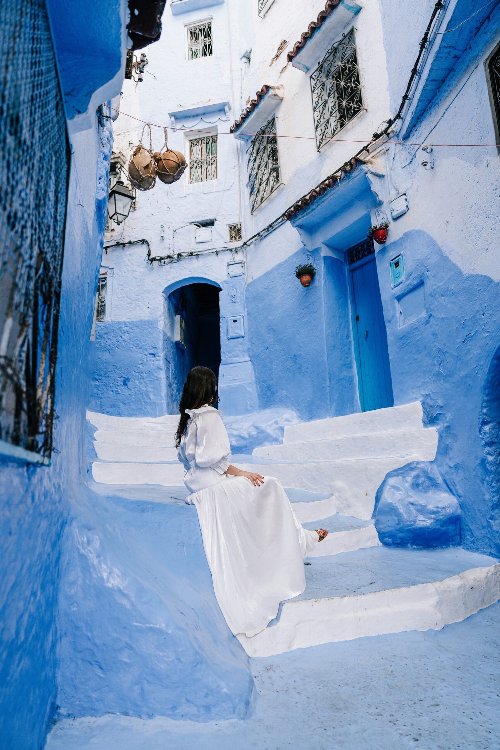 Woman wearing white dress in Chefchaouen