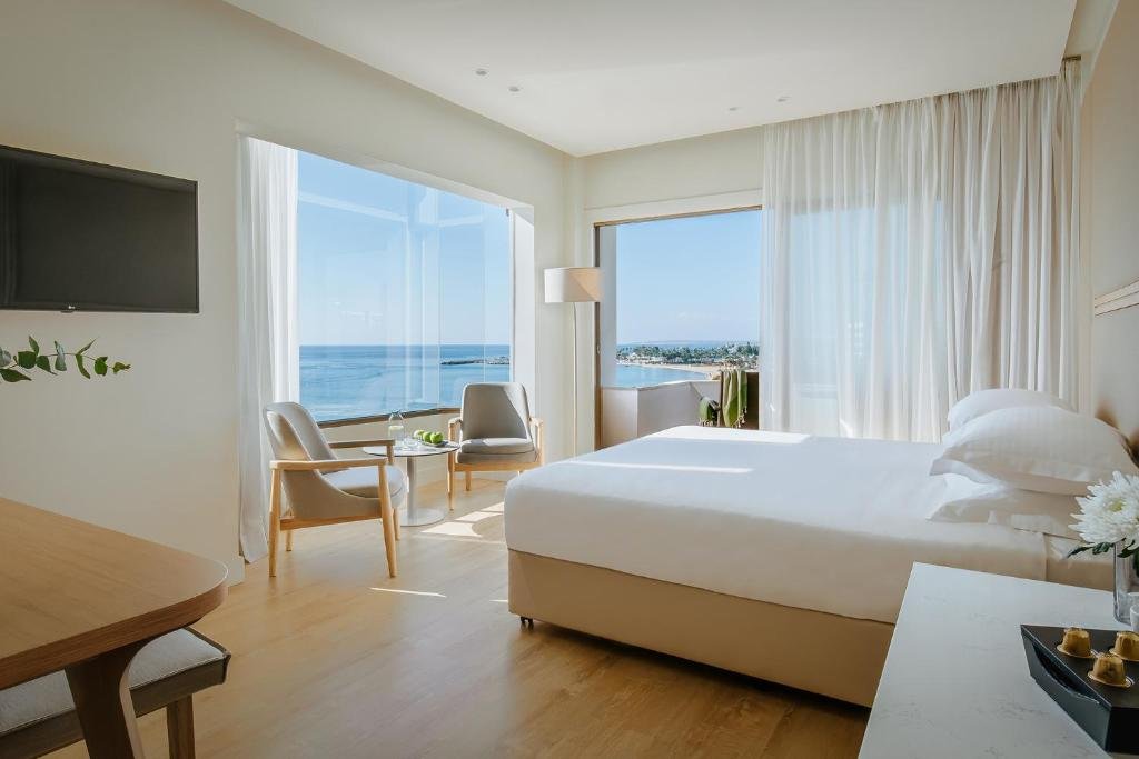Beachfront garden and pool area at Alion Beach Hotel in Ayia Napa