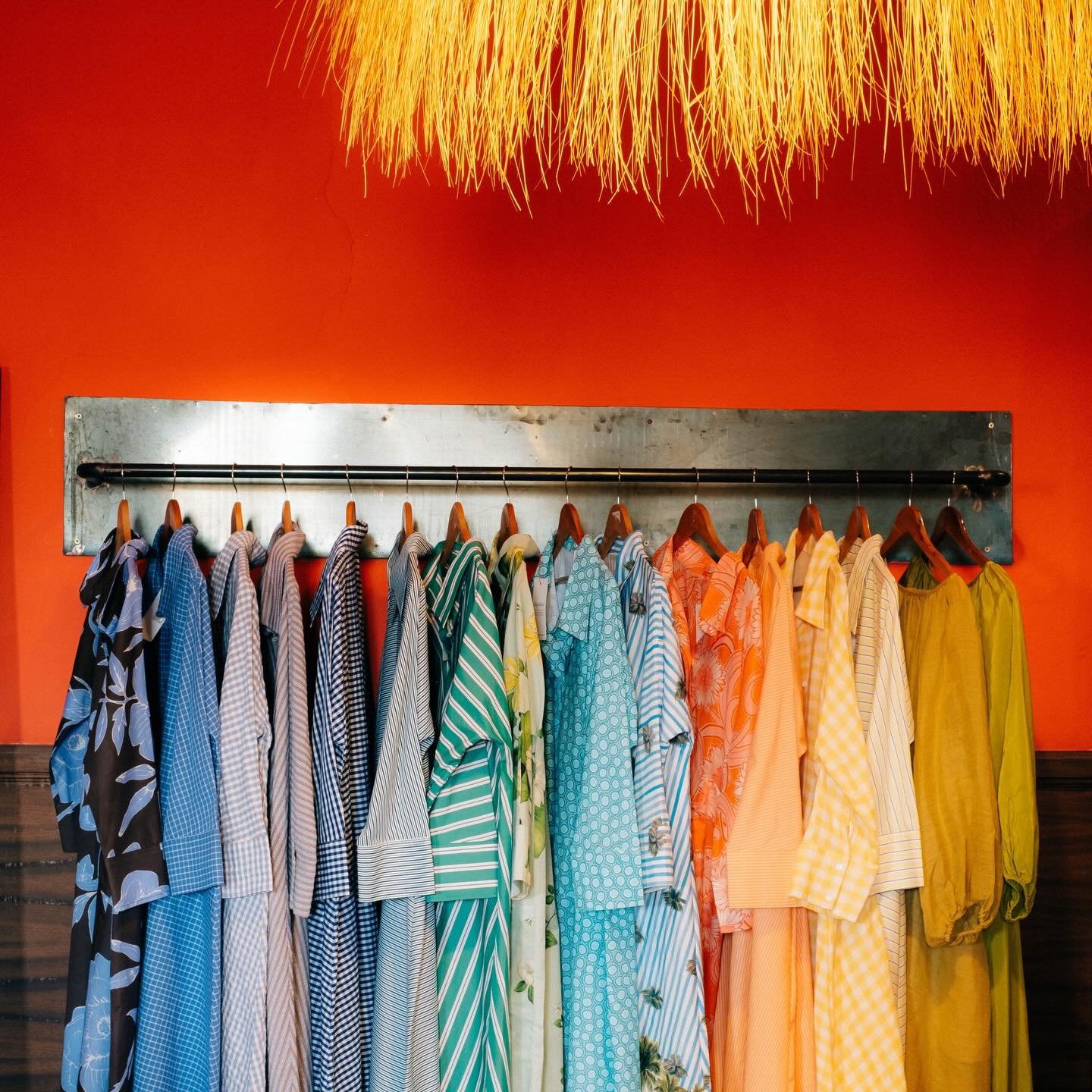 Colourful dresses on rack