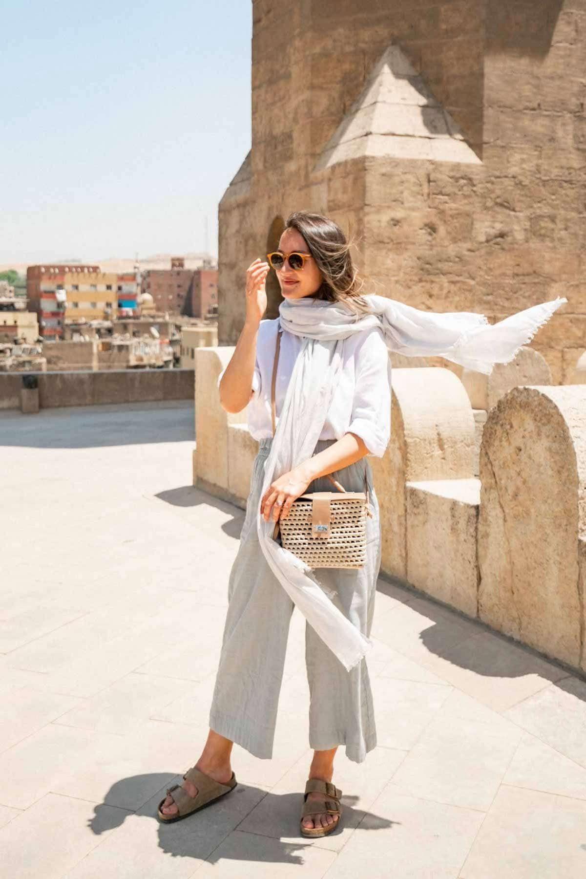 Woman in a loose neutral-toned outfit in the Jordanian desert