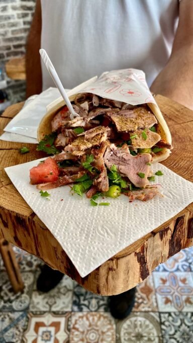 Kelle söğüş dürüm stuffed with finely chopped cold meat, herbs, and spices