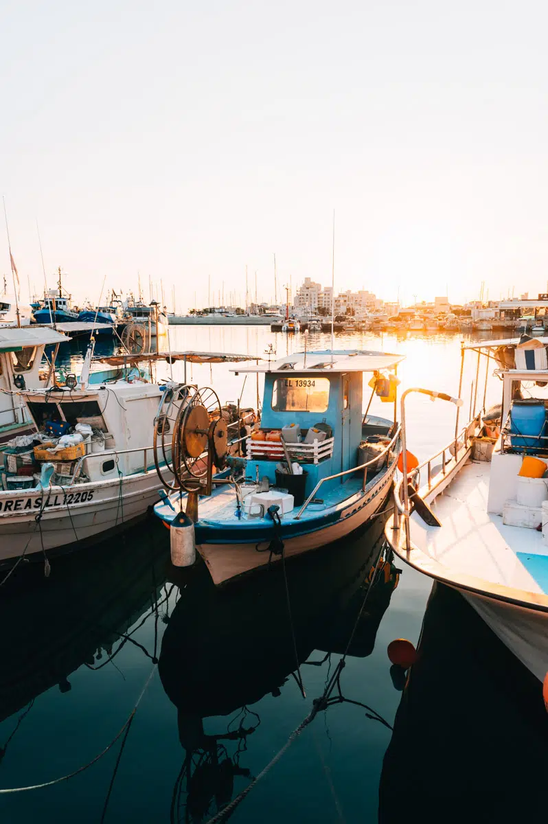 Old Port of Limassol Cyprus with fishing boats and modern waterfront restaurants