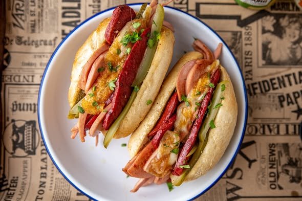 Hot Izmir kumru sandwich filled with cheese, tomato, and cured meats