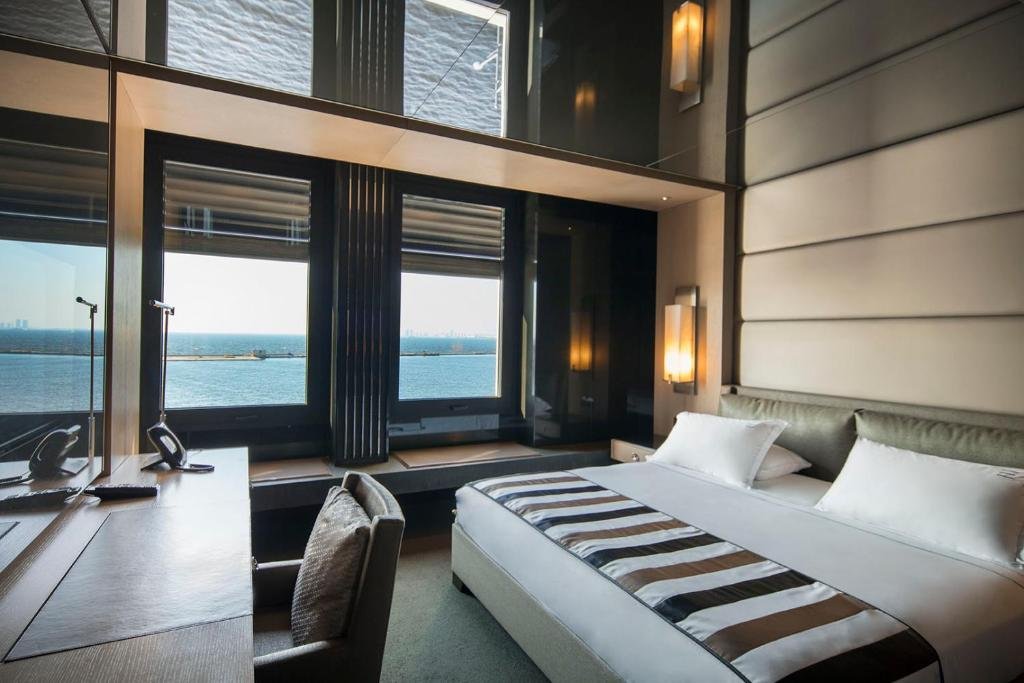 Key Hotel Izmir luxury suite with elegant furniture and waterfront city style