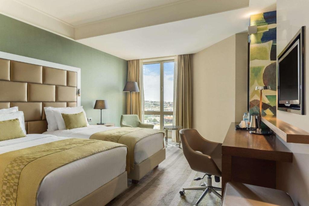 Wyndham Grand Istanbul Europe modern hotel bathroom and guest amenities