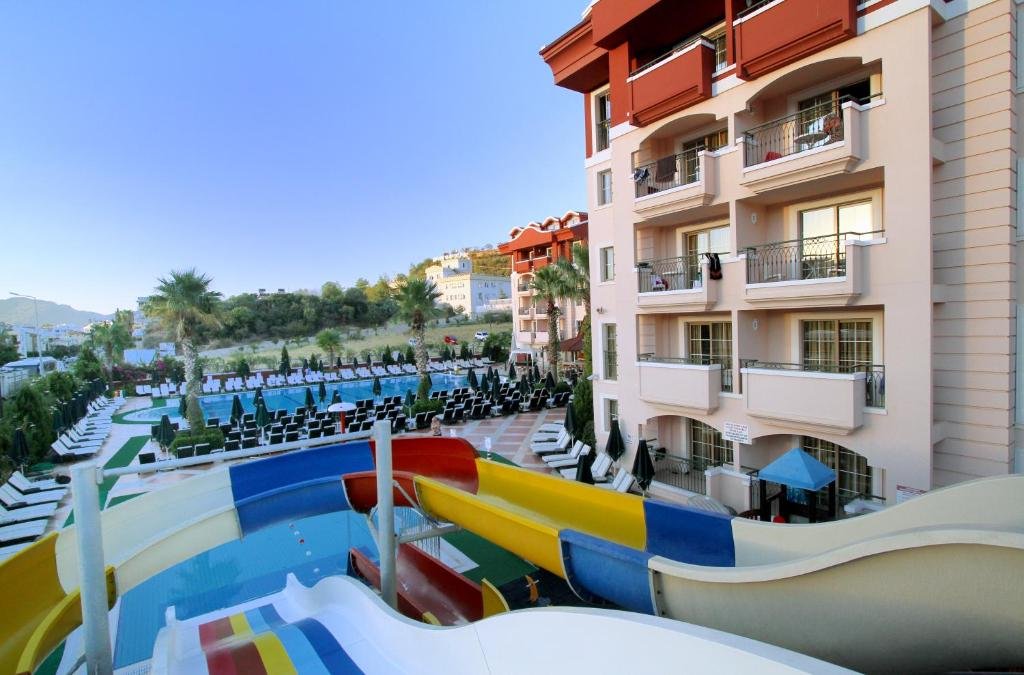 Pool and apartment buildings at Club Aida Apartments in Marmaris