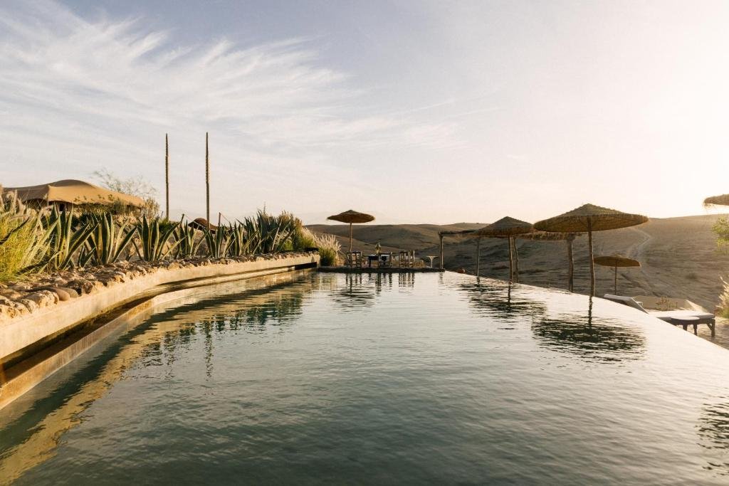 Outdoor seating and desert views at Caravan by Our Habitas Agafay