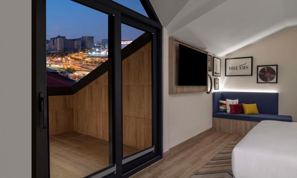 Hampton By Hilton Istanbul Merter guest room with contemporary city hotel design