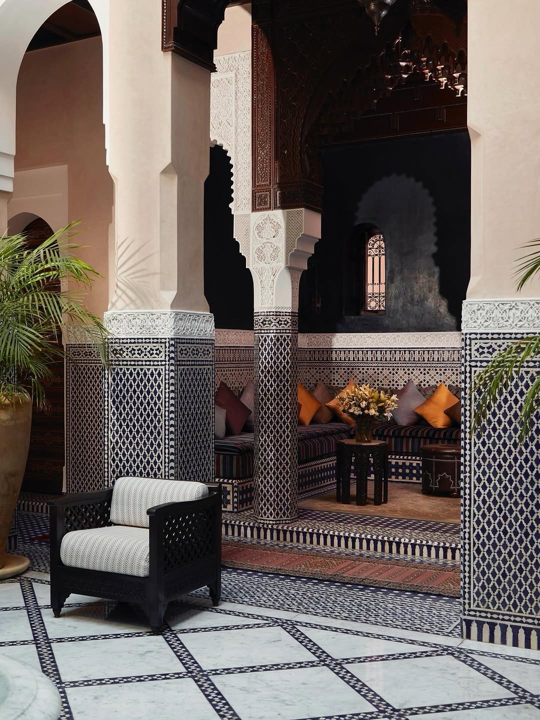 Royal Mansour Marrakech gardens with palm trees, flowers, and peaceful pathways