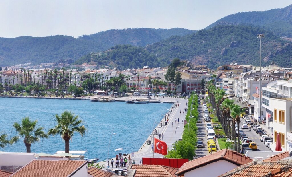 Family walking along the Marmaris waterfront promenade with sea views