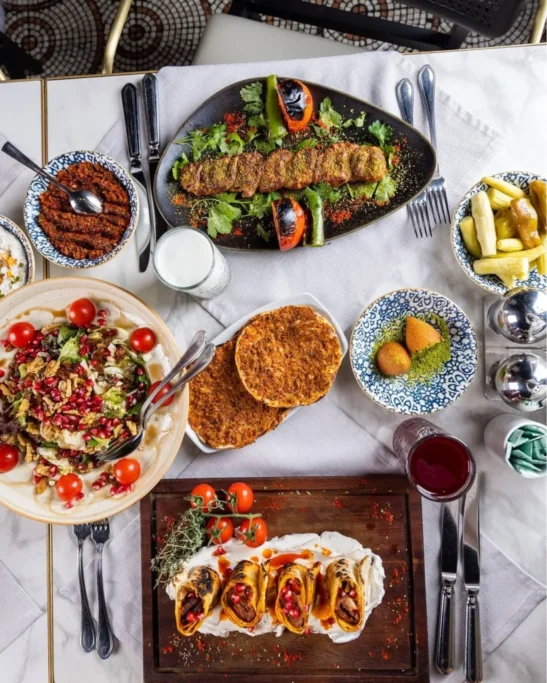 Thin crispy lahmacun served at Develi Istanbul with lemon and herbs