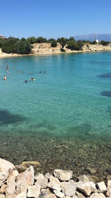 Dalyan Kocakarı Beach in Çeşme with clear deep blue water and sandy shore