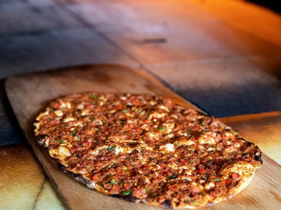 Tike Suadiye lahmacun served with Turkish kebab restaurant sides