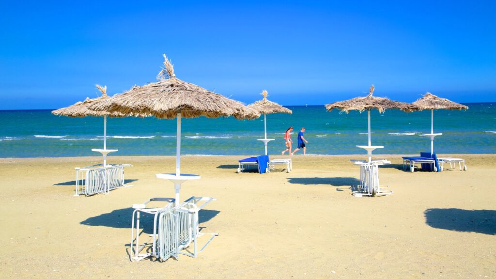 Mackenzie Beach in Larnaca with sandy shoreline near the airport