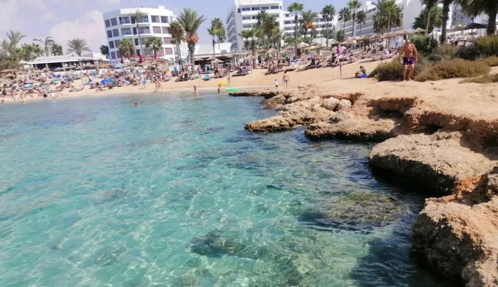 Makronissos Beach in Ayia Napa with clear turquoise water and sandy coves