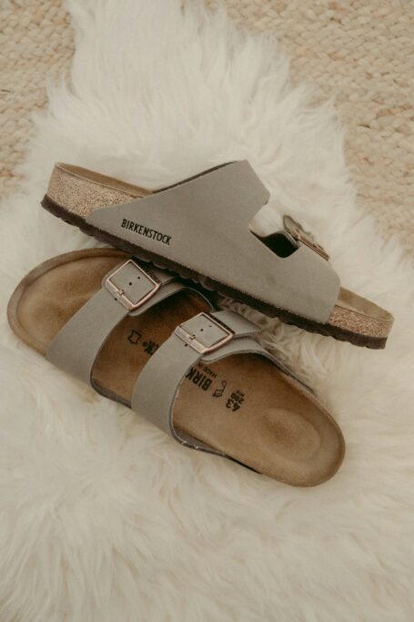 Pair of beige walking sandals with adjustable buckle straps
